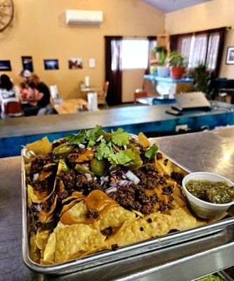 Fast, friendly, and fresh! 
Pictured: Entrée Nachos with Carne Molida