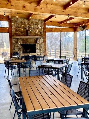 Covered outdoor seating with fireplace.