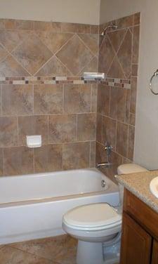 ceramic tile surround bathtub, main bathroom