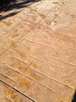 Stamped concrete patio resurfacing after 1 year.