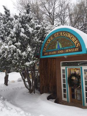 The sign above the side door in the snow