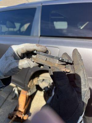 Brake pads supposedly down to the metal. Compared to new, you can see that they are about half worn at worst