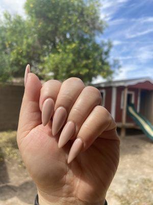 Stiletto nails with nude color acrylic