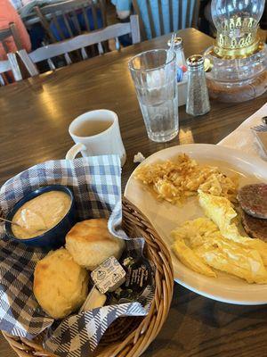 Breakfast.  But I can't see it clear. So I'm. Two eggs hash browns and biscuits and gravy.