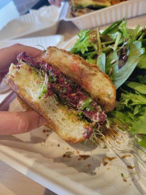 Beet and mushroom veggie burger with side salad