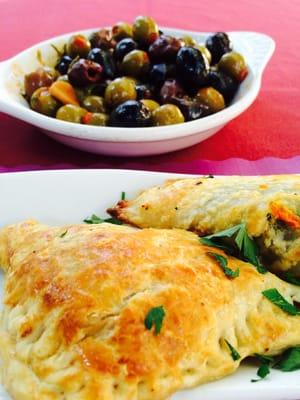 Olives and empanadas! So good! Homemade dough. I got vegetable and beef.