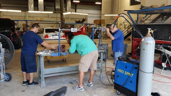 Raul and Alex taking their aluminum welding tests.