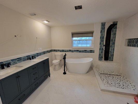 Freestanding stub, tub faucet, double vanity and custom shower