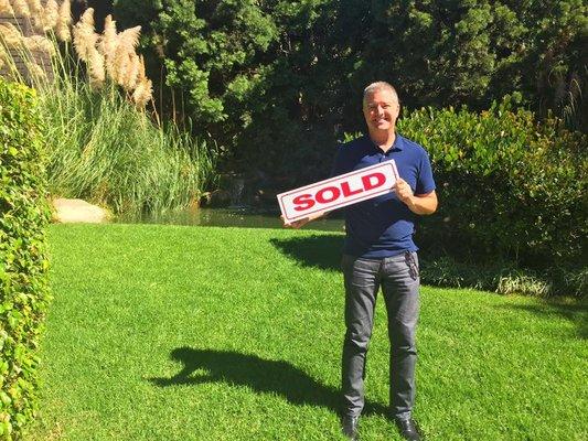 My client David Bowen in front of the stunning foliage which is part of the complex where he just purchased a condo!