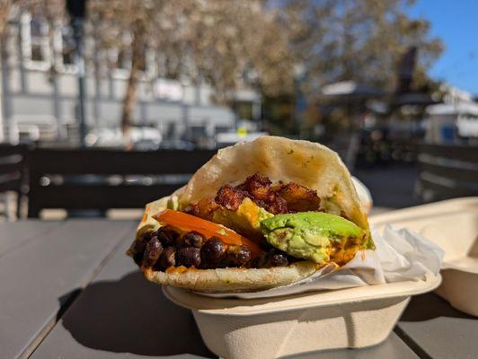 Delicious plantain and black bean arepa.