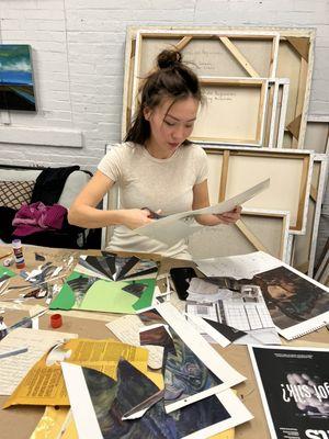 Student at work on a collage class