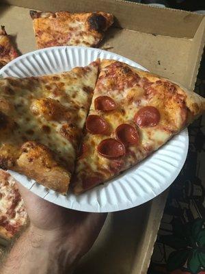 Slice from a large cheese and pepperoni extra crispy