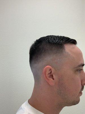 Got a razor mid fade with a comb over. I think that's what it's called.