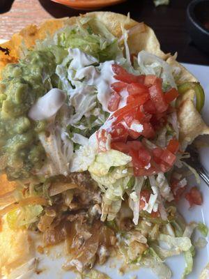 Taco Salad  Ground Beef, beans, lettuce, tomatoes, cheese, guacamole and sour cream.