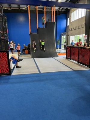 Like ninja warrior !! So many cool things to do!  Here's their version of Warped wall  It was awesome !