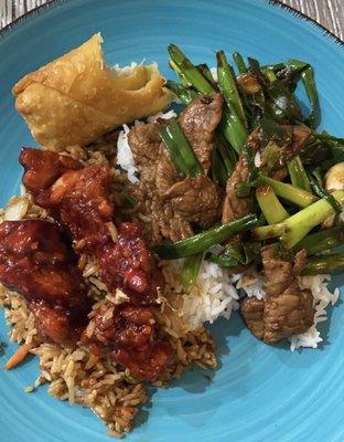 General tsos chicken with veggie fried rice, steak and scallion and an egg roll