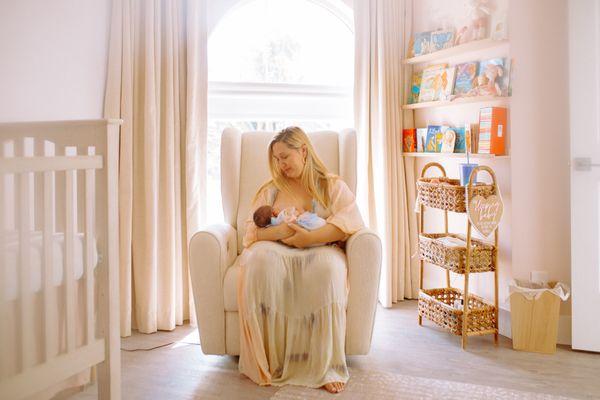 Breastfeeding the newborn in their first bedroom :)