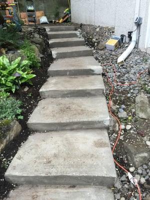 these are the TERRIBLE stairs he poured for me. patched with unmatching concrete