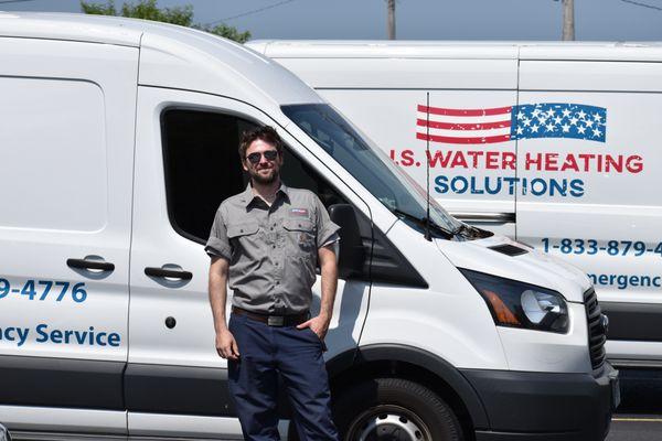 Michigan Tech, Kurt, next to his company service van while attending training in Illinois.