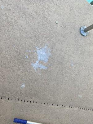 Damage from tech spilling acid on my concrete pool deck.