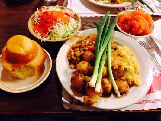 Succotash, roasted potatoes, squash casserole, yams, and their famous yeast roll & Niki's cole slaw