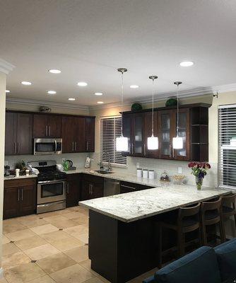 Dark wood shaker style cabinets with light countertops, always classic and never out of style!