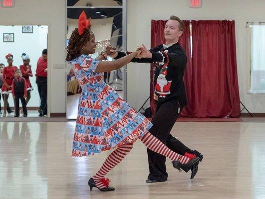 Denis dancing foxtrot with student at showcase