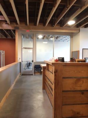 Reclaimed wood front desk.