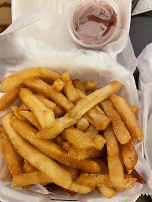 French fries, well done as requested, with ketchup