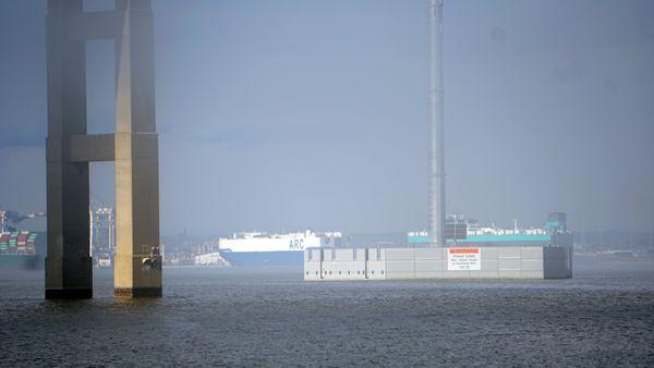 A boat traverses the Patapsco River under the I-695 Bridge and heads into the Port of Baltimore/Baltimore Harbor.