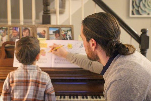 Instructor James working with a piano student (age 5)