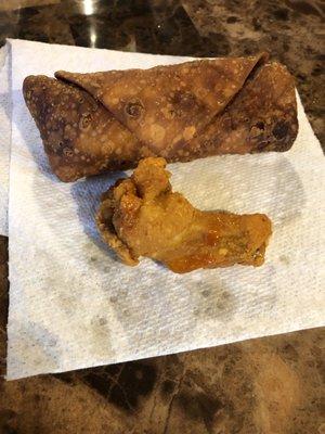 Disgusting burnt , greasy egg roll and chicken wing