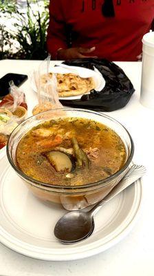 Hearty beef soup w/ pupusas.