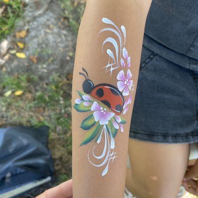 Lady bug arm painting