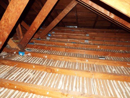 Cleaned up and rewired attic ready for airsealing and new insulation. ATG performed all work from removal to reinsulation.