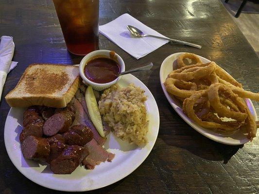 Two meat plate - sliced brisket and German sausage with German potato salad and onion rings. It was pretty good!