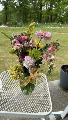 Flowers he received along with a limp balloon. This picture was made the next day after flowers were delivered.