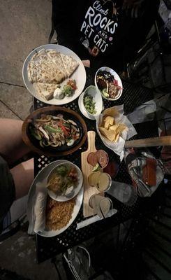 Our food--Mexican flight, chicken fajitas, cheese quesadilla, chips and Guacamole, Grilled Chicken Border Bowl...