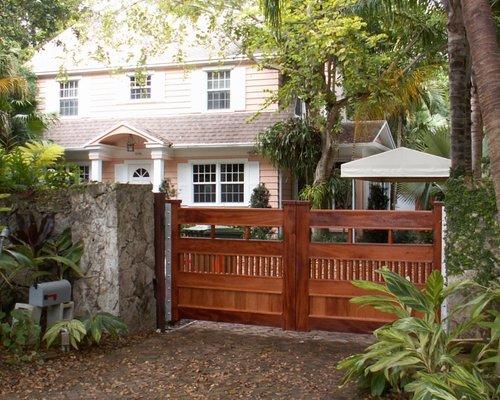 Custom Mahogany gates in Coconut Grove with automatic openers that are hidden.