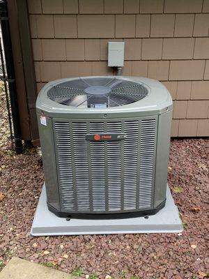 A newly installed Trane outdoor condenser unit