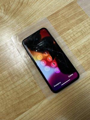 iPhone X cracked screen and broken LCD.