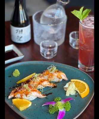 Seared salmon nigiri, house sake and cocktail.