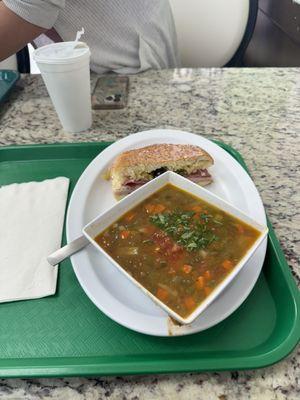 Half Famous Muffuletta Oven Roasted Turkey Breast Sandwich with a side of lentils