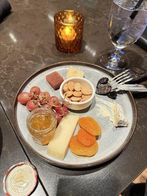 The cheese plate, with a nibble on the Brie cheese that was about one third larger when it came out..