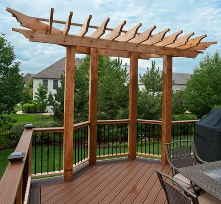 Trex deck with accent deck border and decorative cedar pergola.