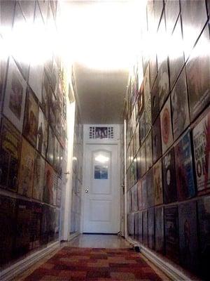 Records cover the hallway walls.