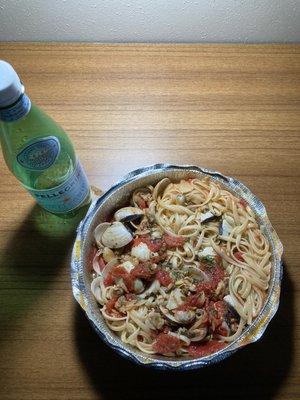 Linguini with clams in red sauce.