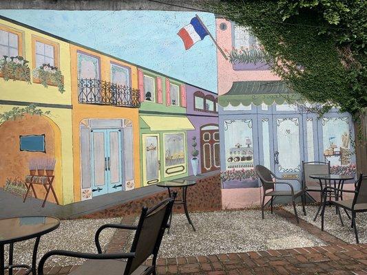 Cute outdoor seating behind the shop.