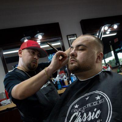 George The Classic Barber pays attention to the finer details on a man's haircut