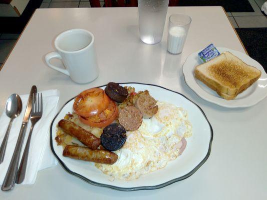 Irish Breakfast: Farm-fresh eggs, sausage, black & White pudding, grilled tomato, Irish bacon, toast, juice and coffee. Delicious!